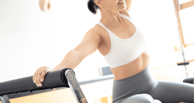Woman sitting and doing Pilates