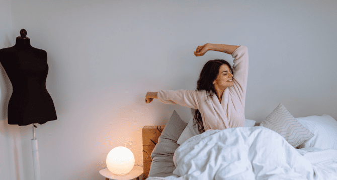 A woman gets up and stretches