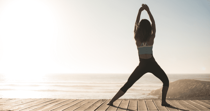 woman stretching at the seaside