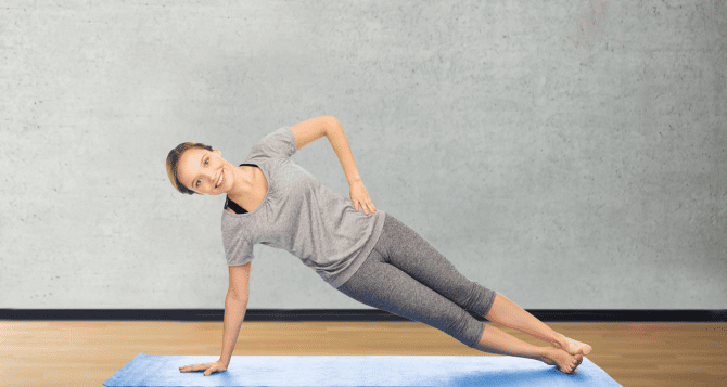woman doing side plank