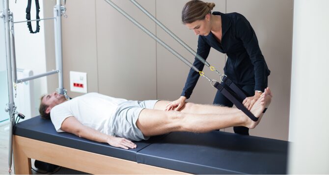 Male and female staff receiving Pilates