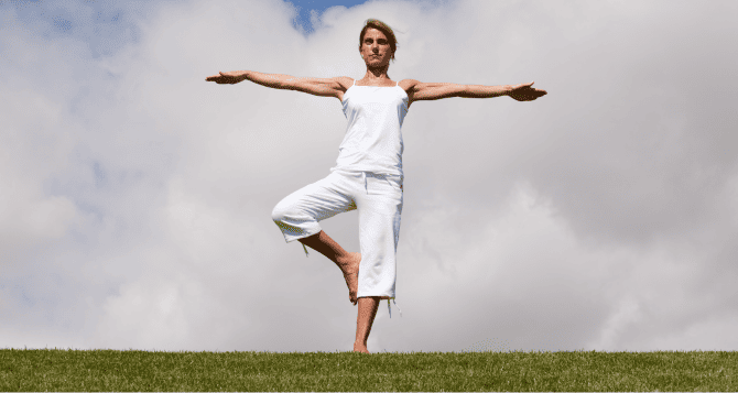woman standing on one leg